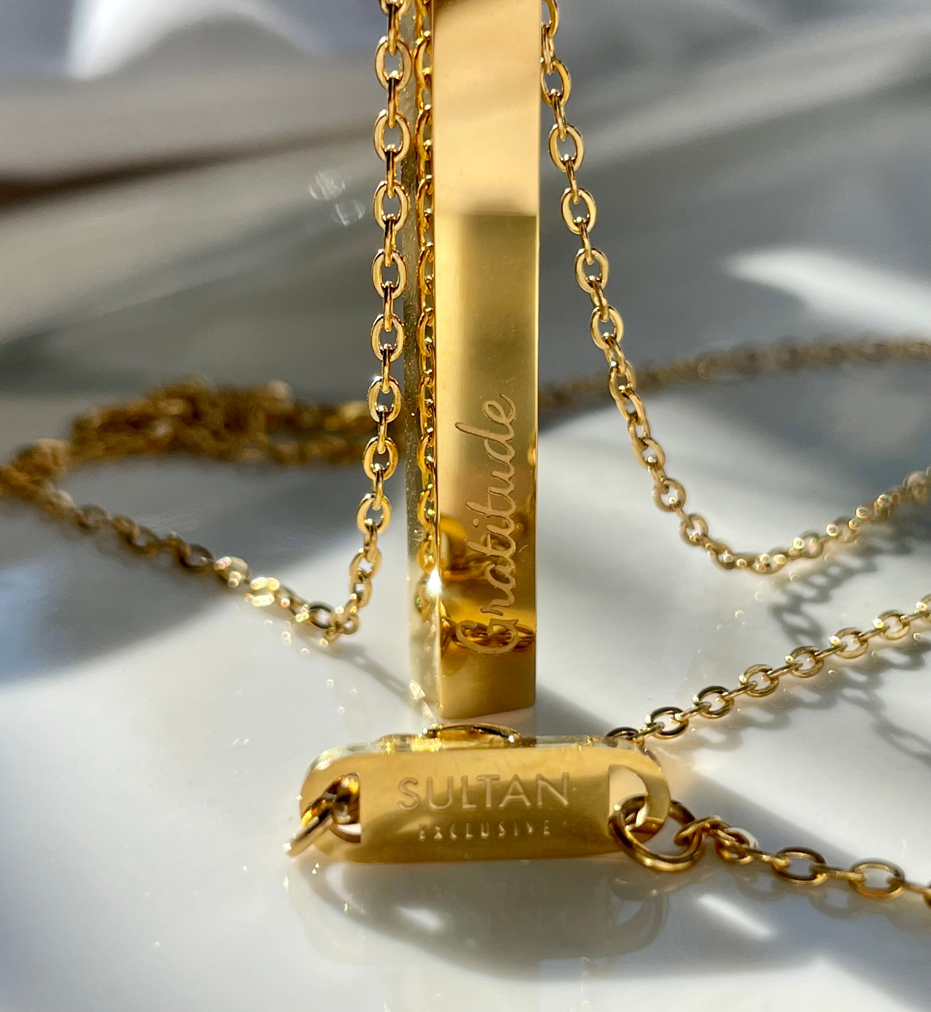 Supreme gold hot sale bar necklace